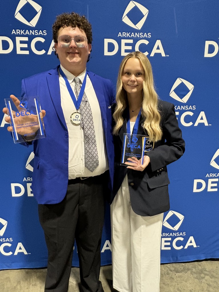 students posing with awards