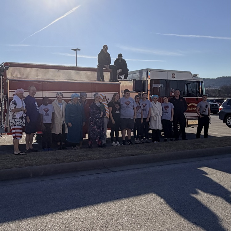 volunteers in front of truck 