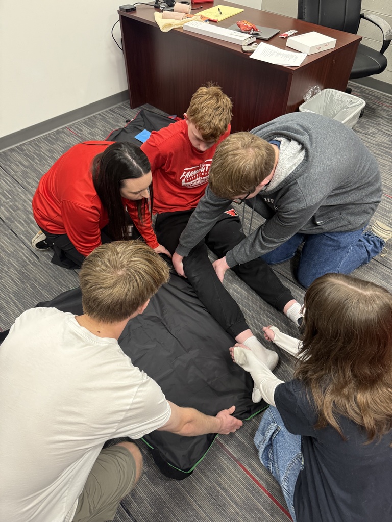 students fake splinting another student