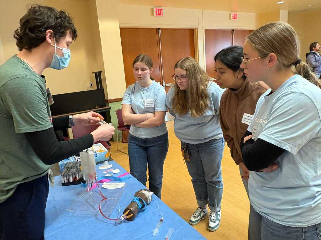 students looking at medical equipment