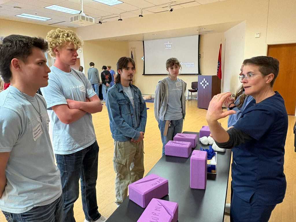 students looking at medical equipment