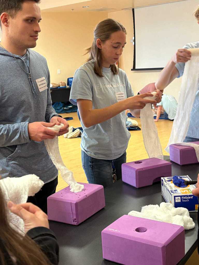 students looking at medical equipment