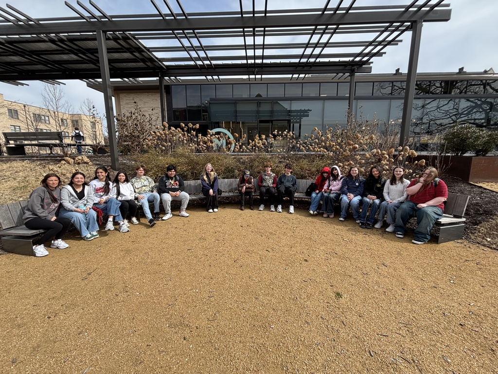 students sitting on a bench together