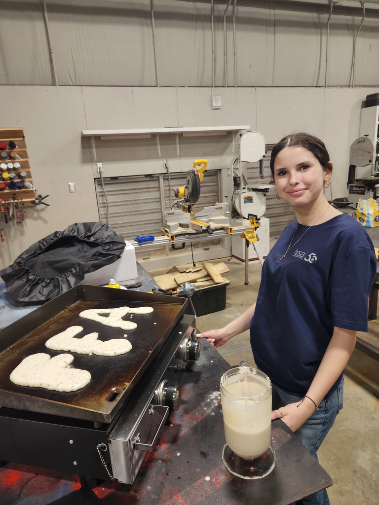 students cooking pancakes