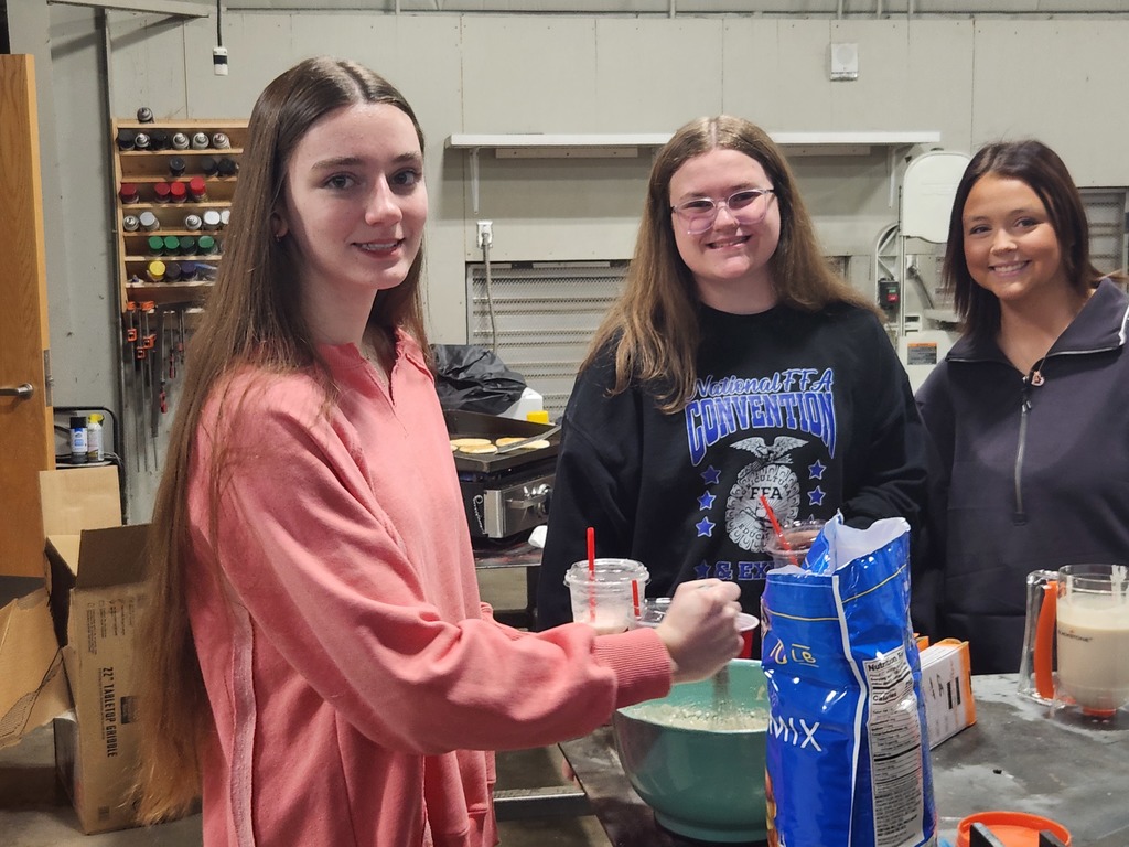 students cooking pancakes