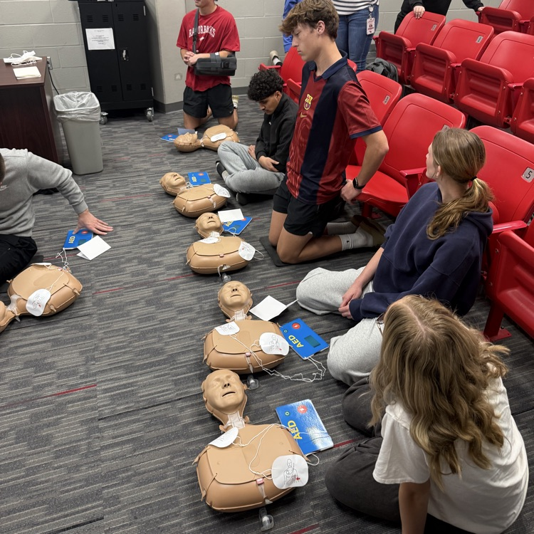 students practicing CPR