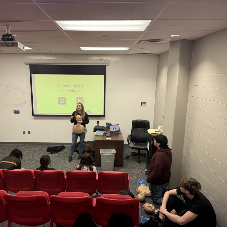 students practicing CPR