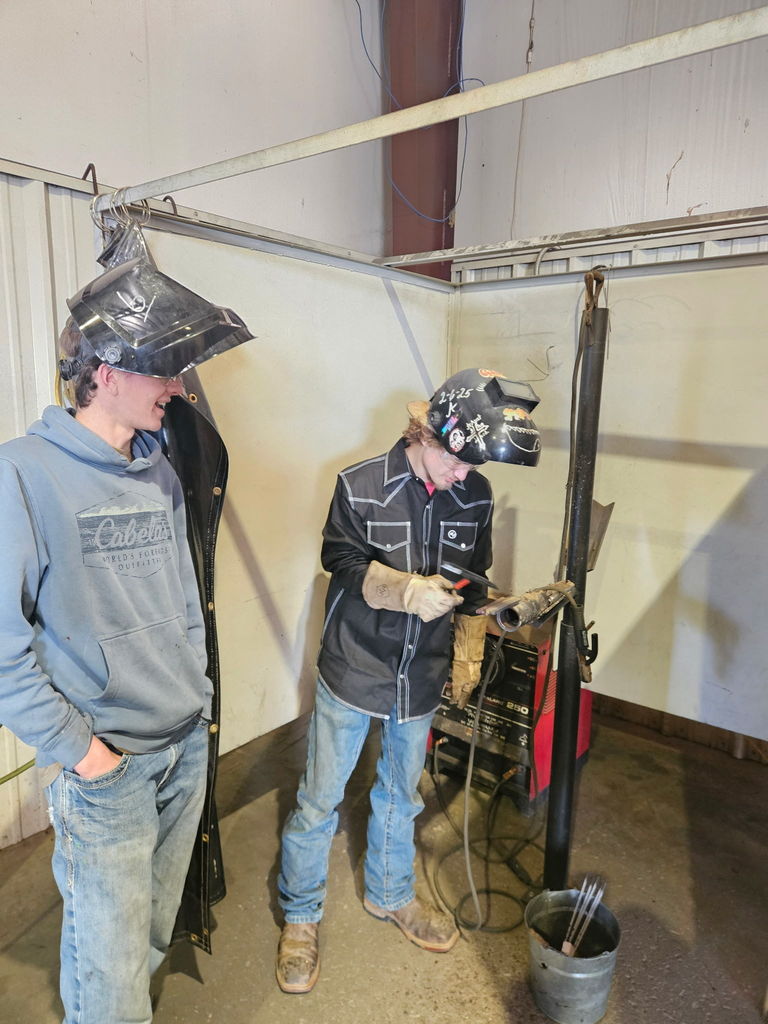 students welding 