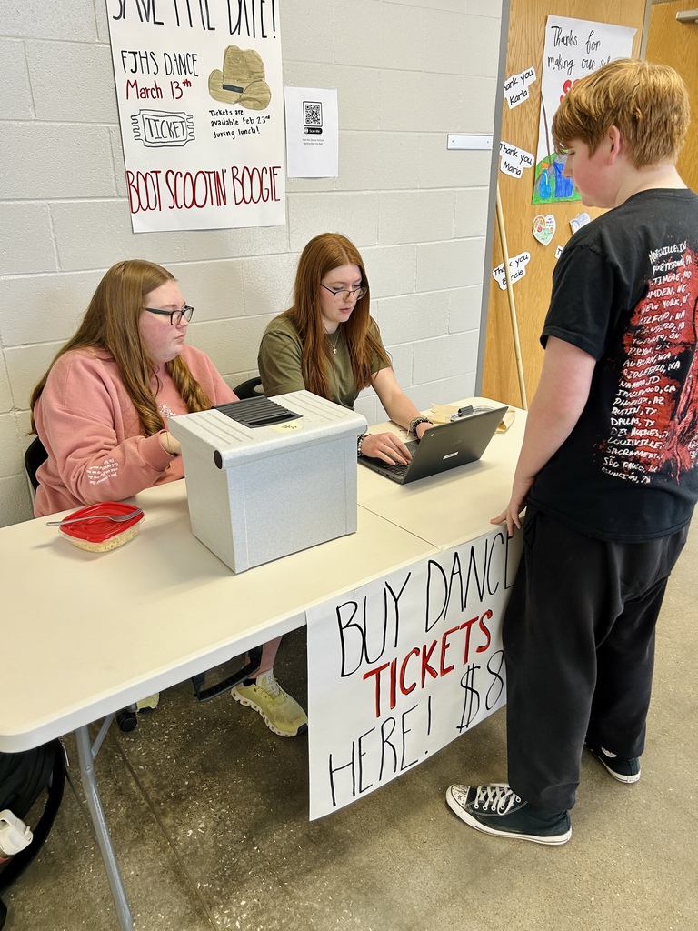 Student buying dance tickets