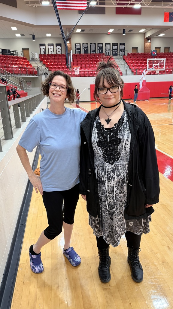 paraprofessional posing with student