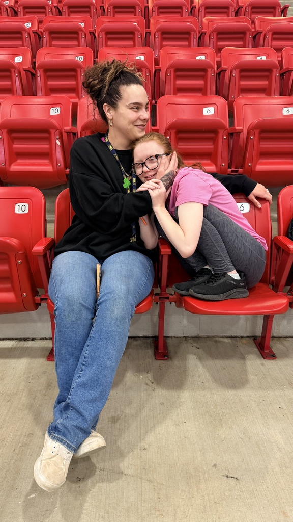 paraprofessional posing with student