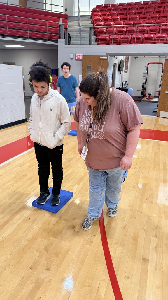 paraprofessional posing with student