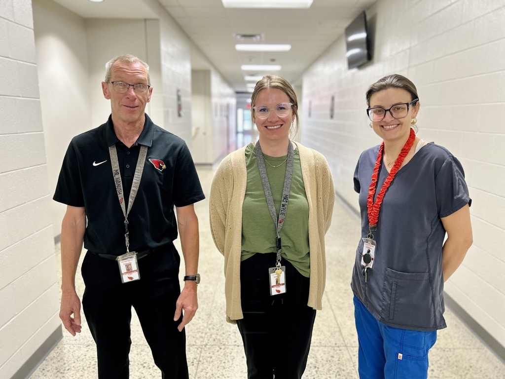 3 paraprofessionals in hallway