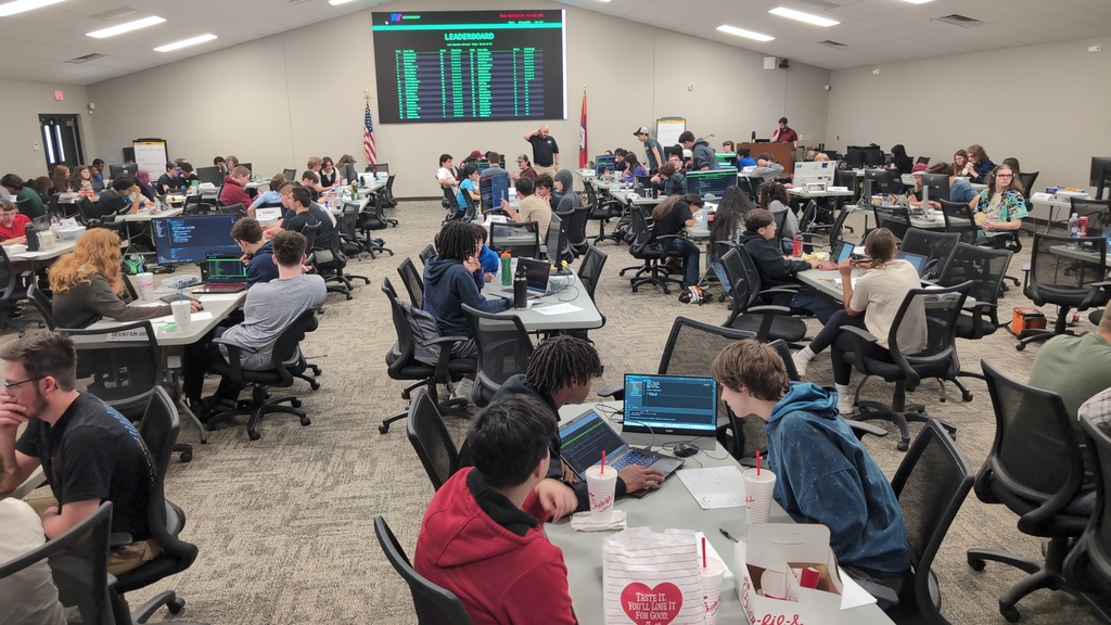 students coding in a room