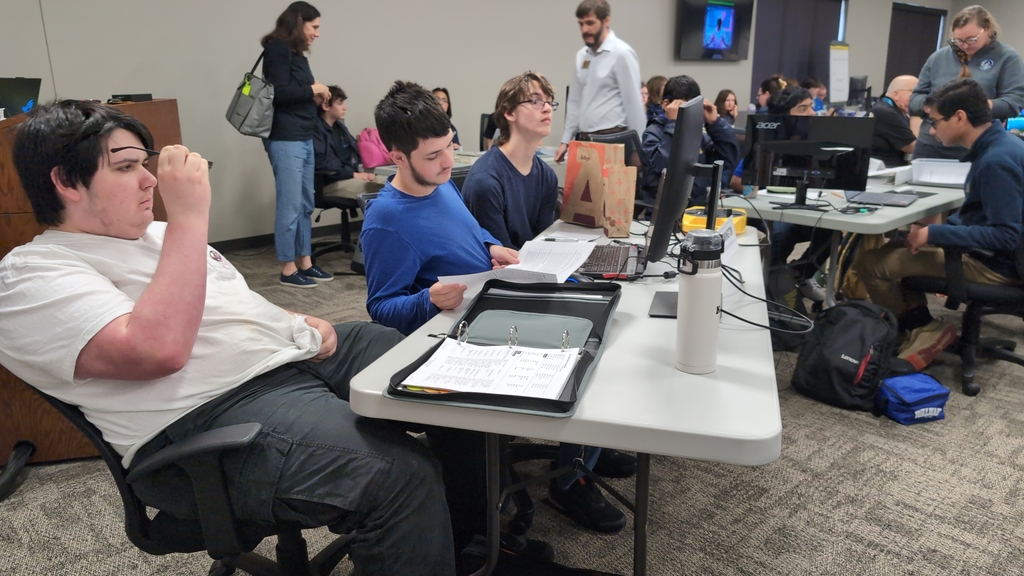 students coding in a room
