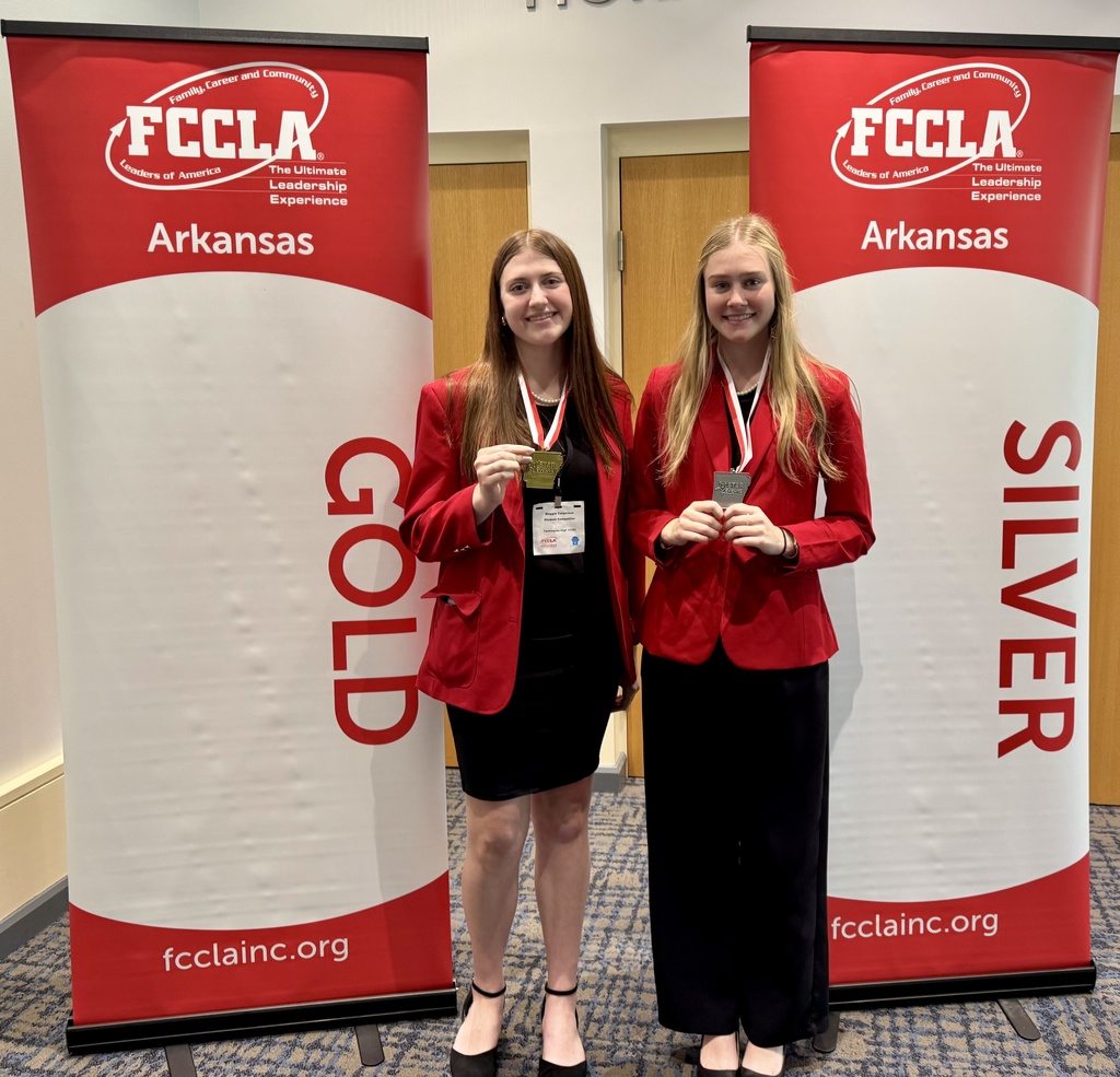 students posing with medals