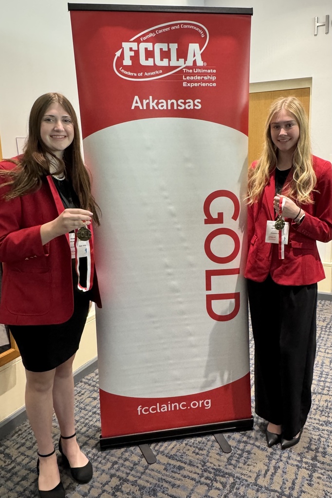 students posing with medals