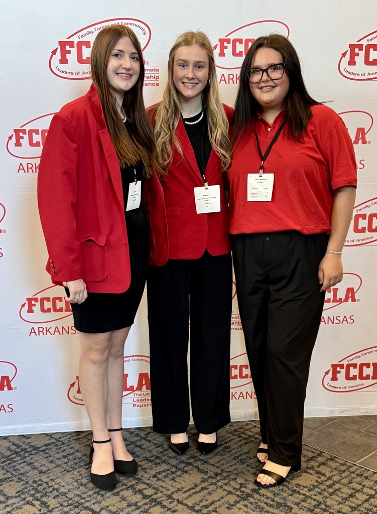students posing with medals
