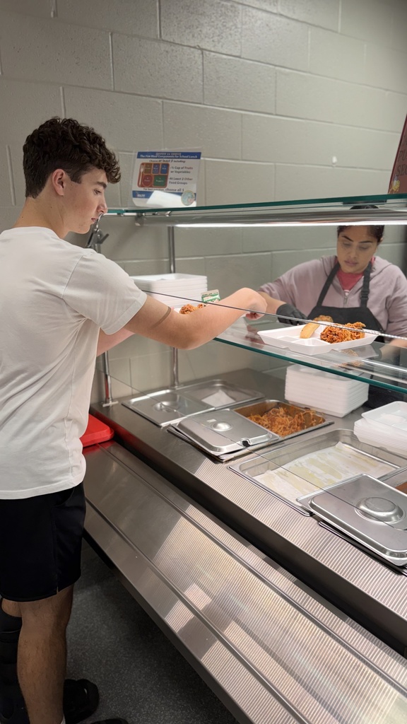 picture of lunch staff serving lunches