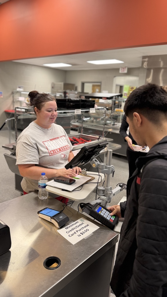 picture of lunch staff serving lunches