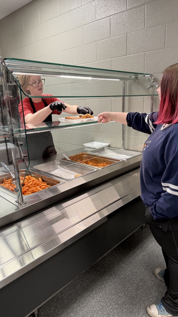 picture of lunch staff serving lunches
