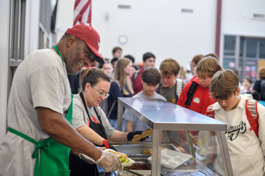 Serving students in cafeteria