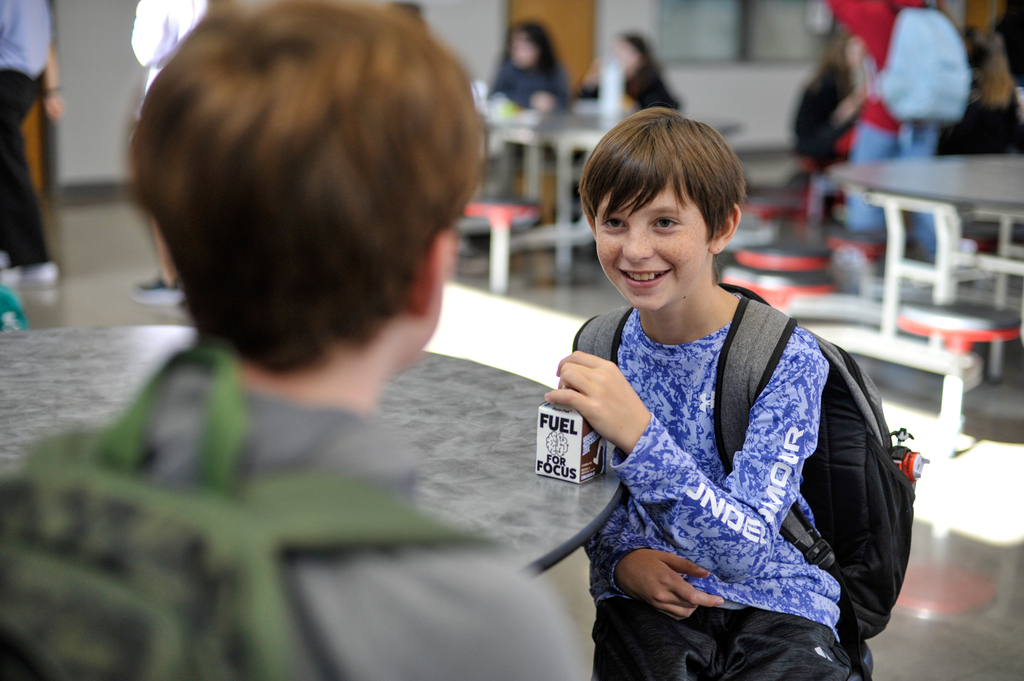 Student smiling in cafeteria