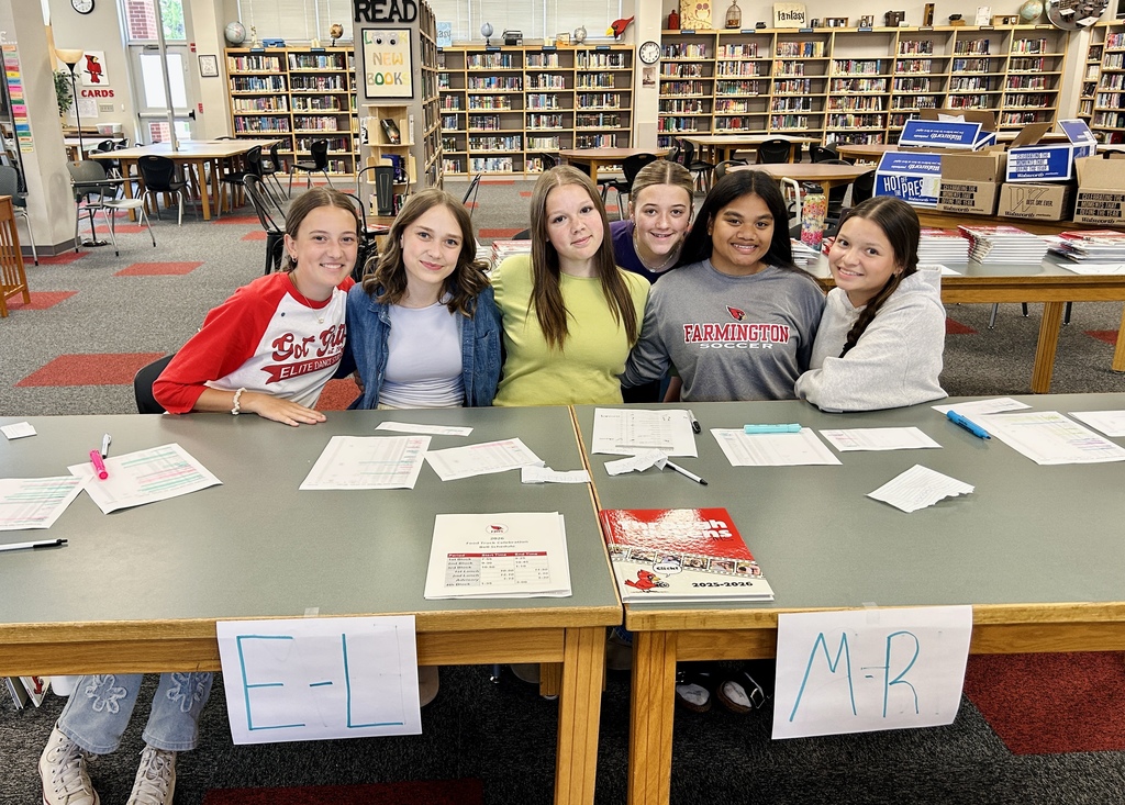 Yearbook staff distributing yearbooks