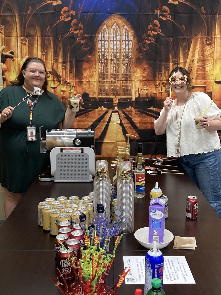 picture of teachers posing with soda bar