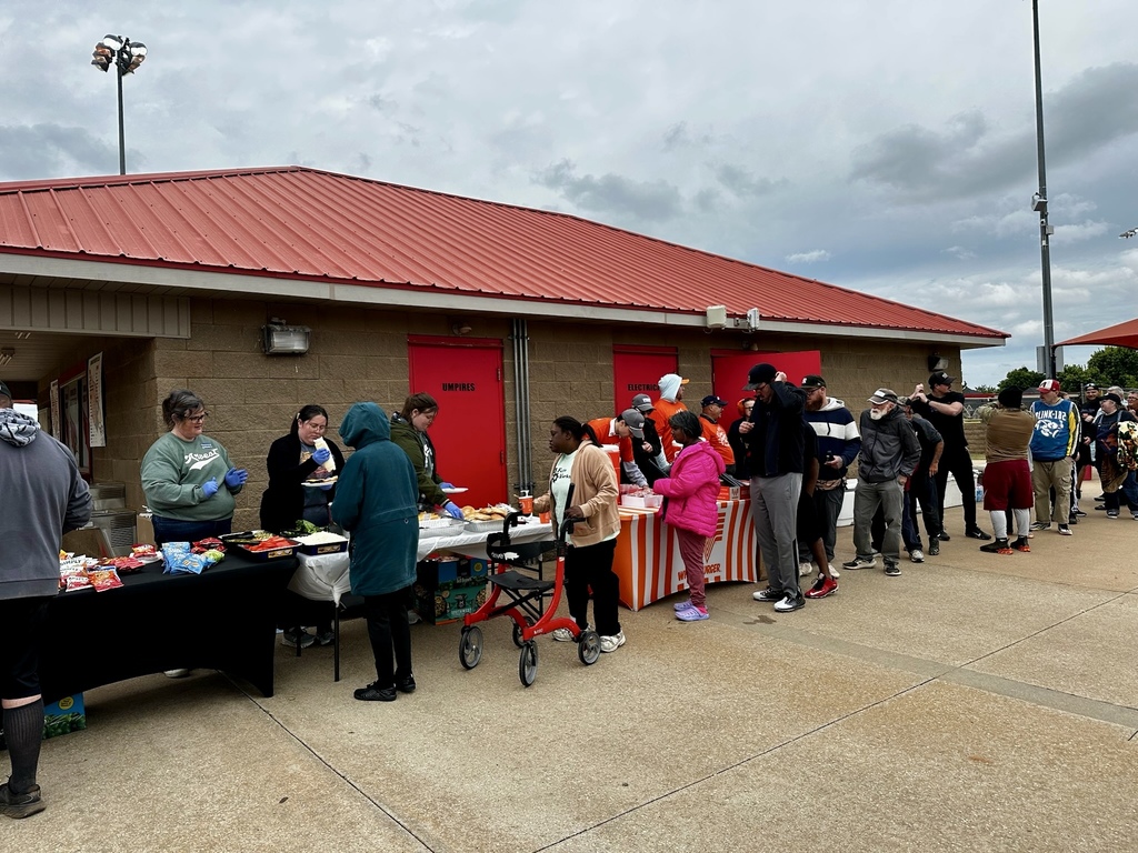 people standing in line for lunch