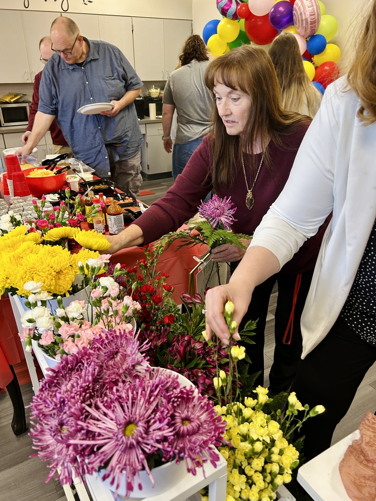 teachers getting flowers in lounge