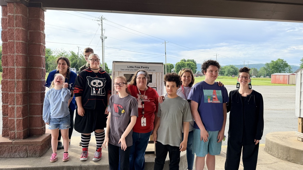student stocking pantry