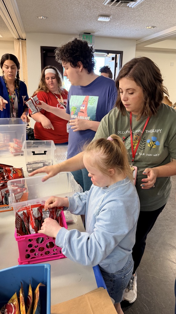 student stocking pantry