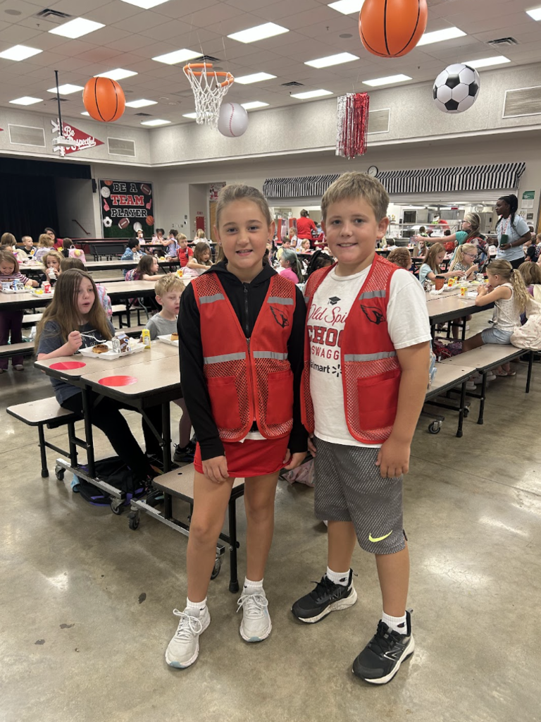 Ambassadors help in the cafeteria during breakfast