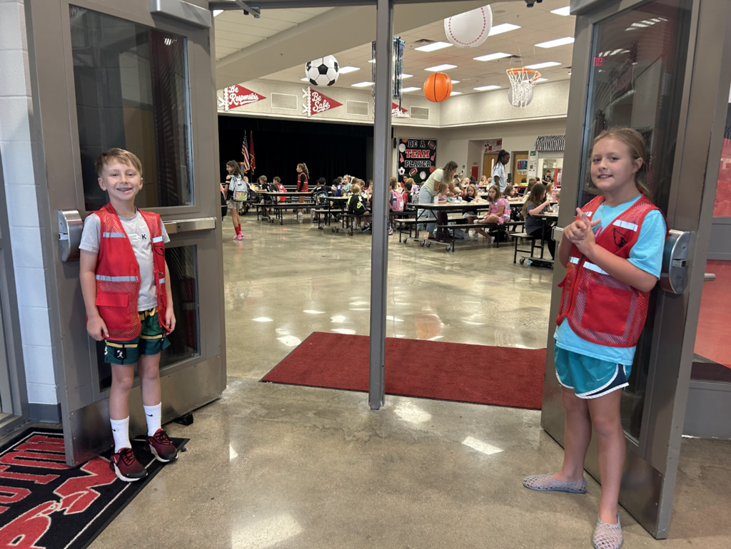 Ambassadors greet students in the morning