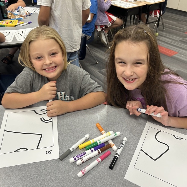 two girls smiling