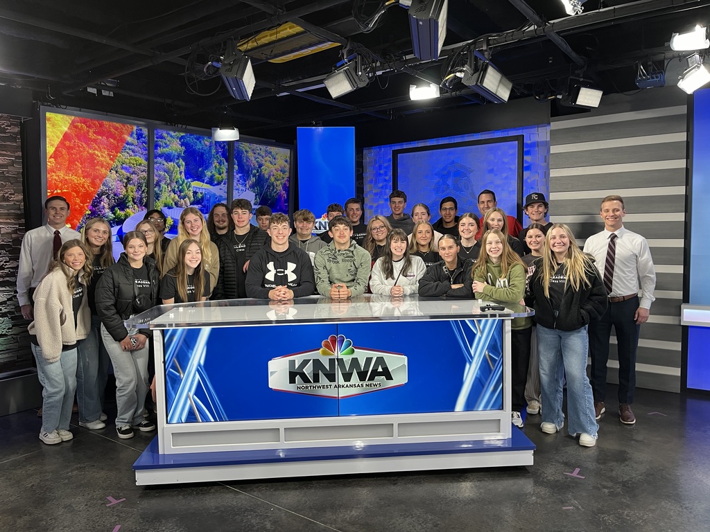 students at news desk