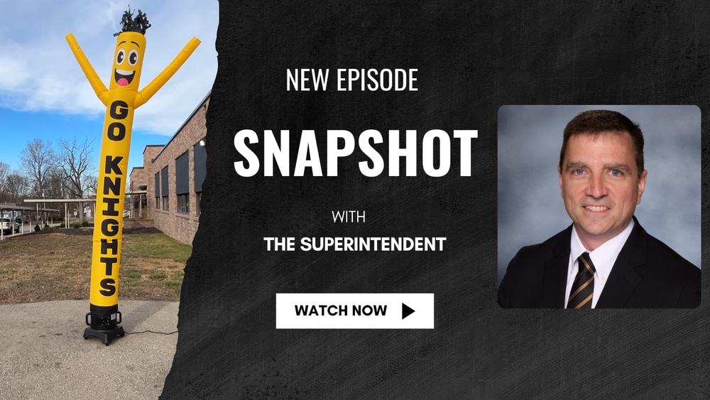 Dr. Gibbs and a photo of Dancing Dan the air inflatible