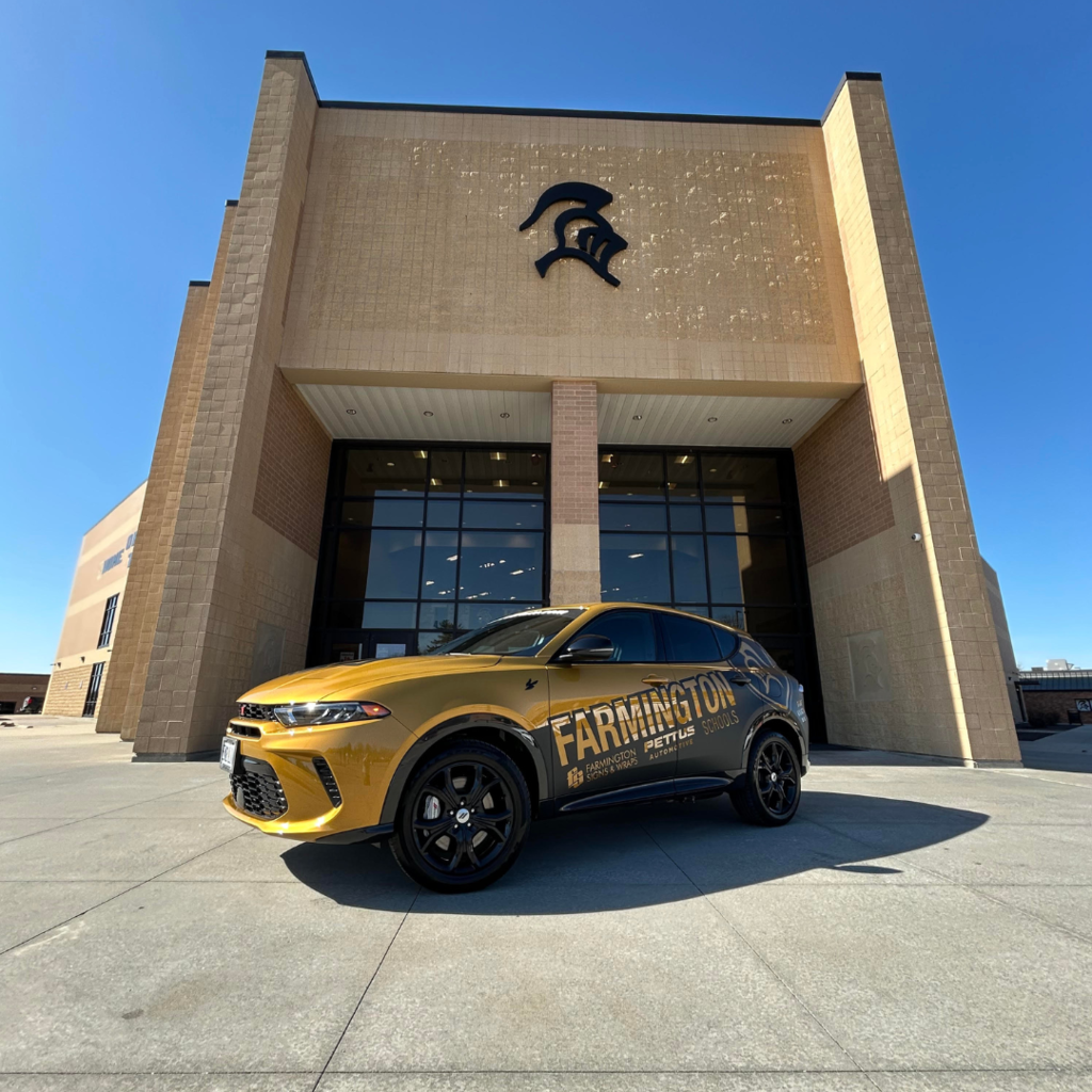 car in front of the Black Knight Fieldhouse