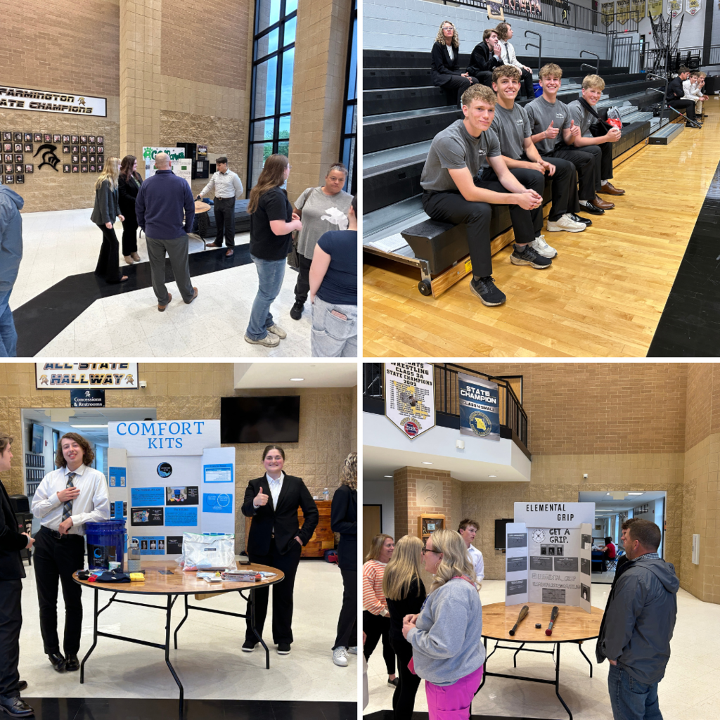 audience members looking at each groups products in the lobby prior to the pitches