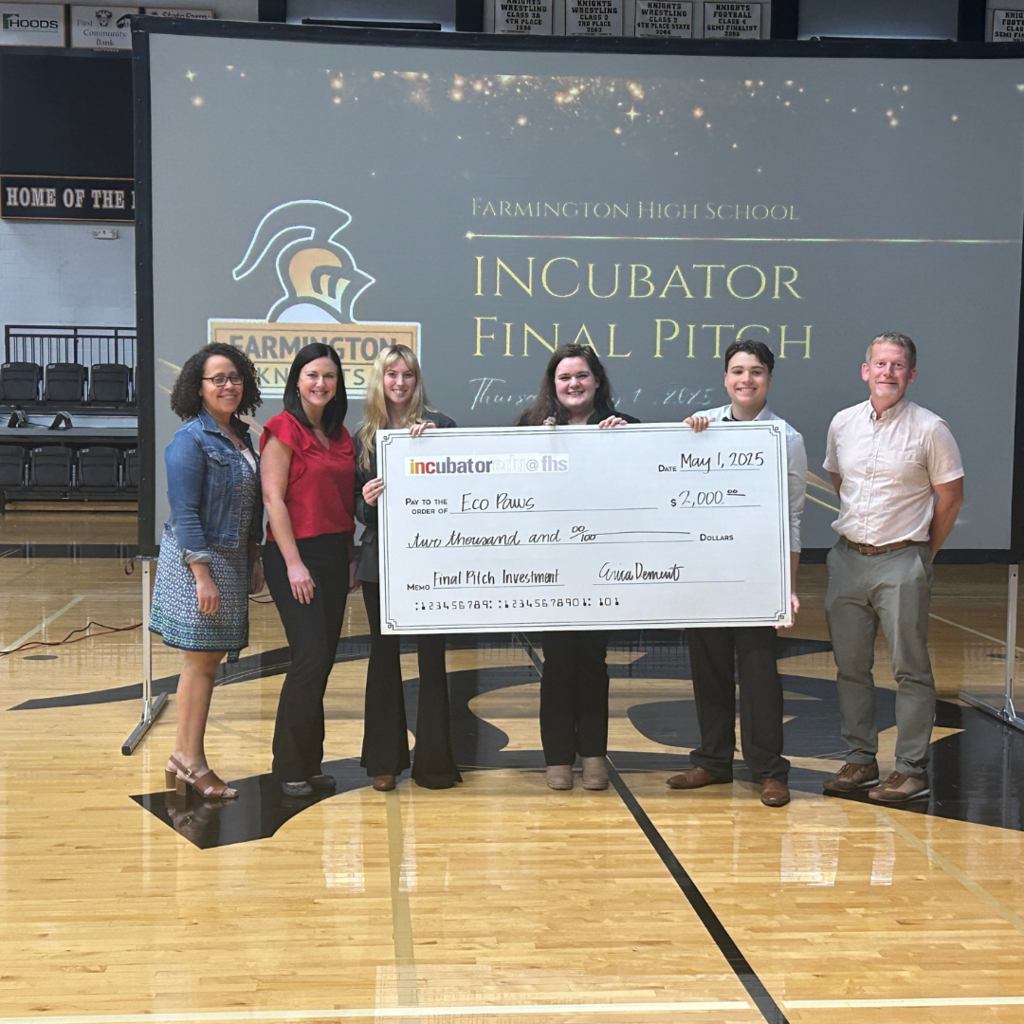 ecopaws group and the judges with the large check