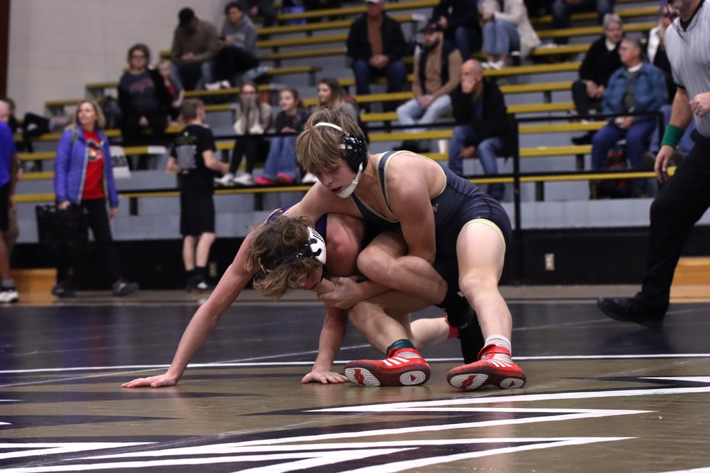 Farmington wrestler wrestling at at match
