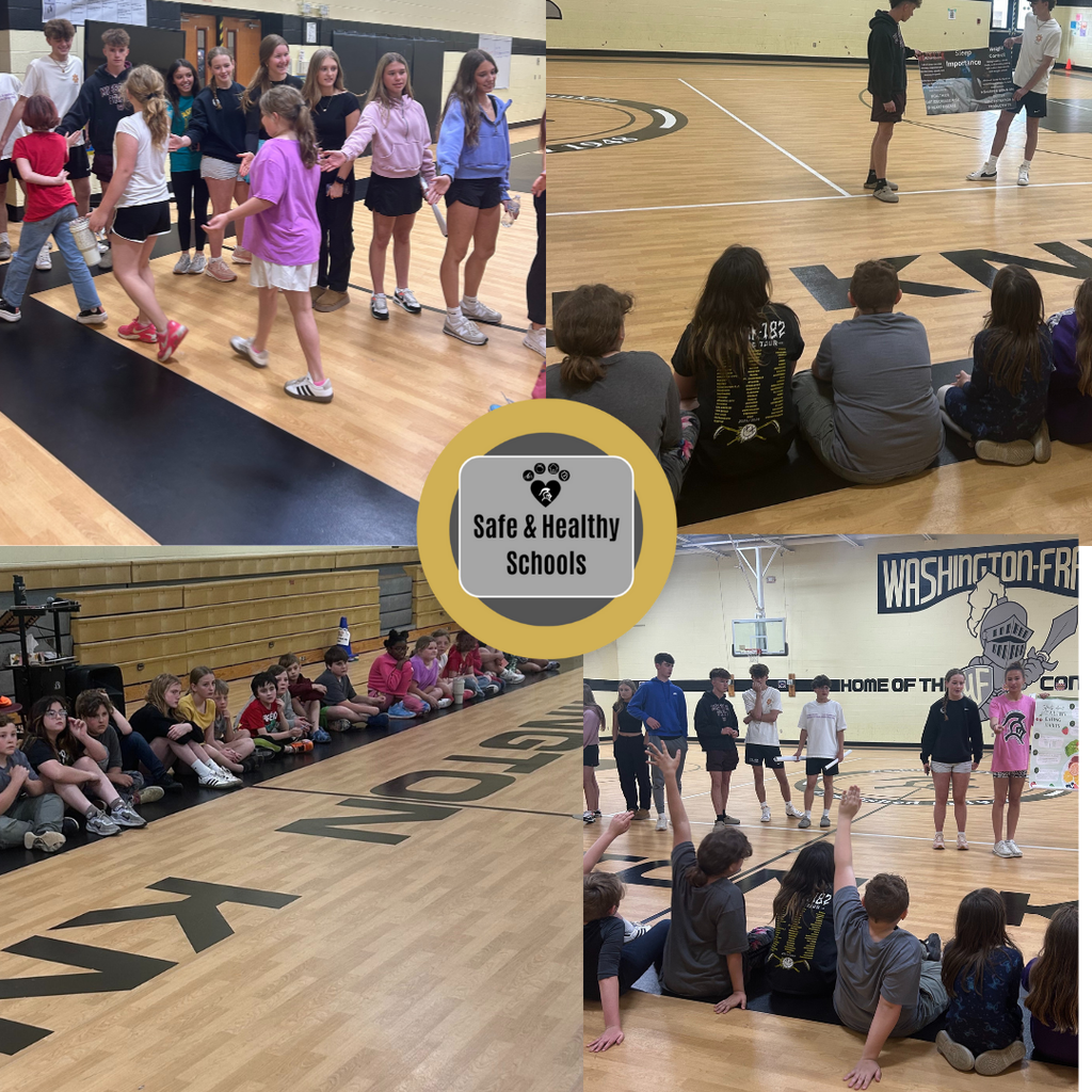 High school students teaching healthy habits in the gym to Washington-Franklin 4th grade students