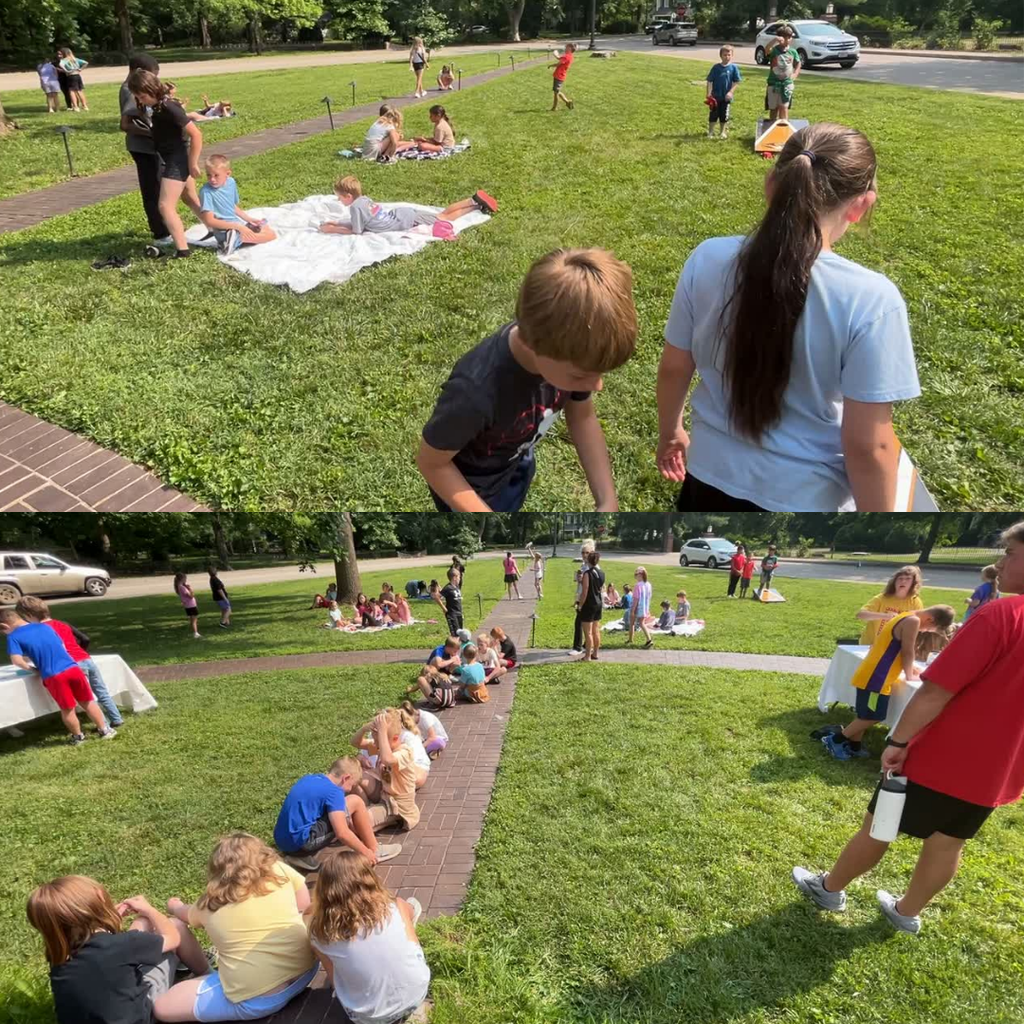 students playing in the yard waiting for their tour