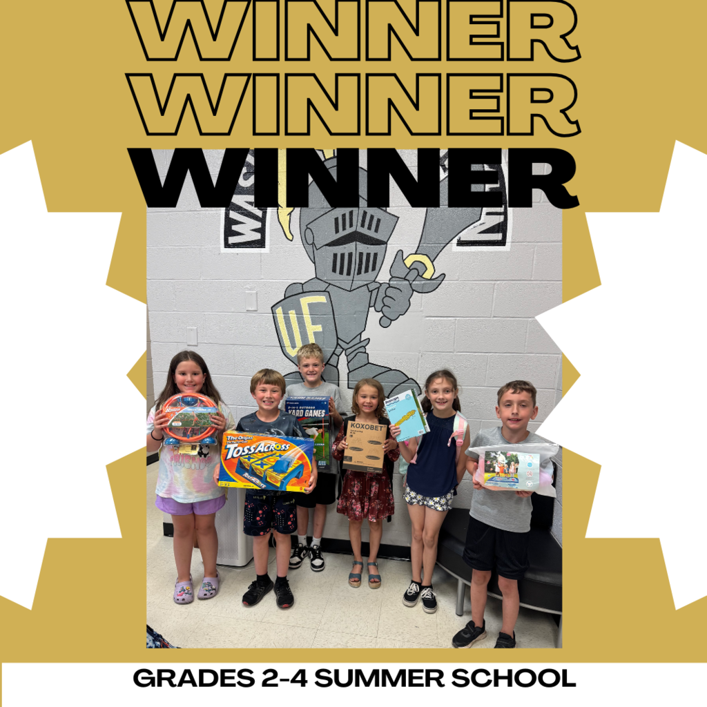 picture of the winners with their prizes of yard games