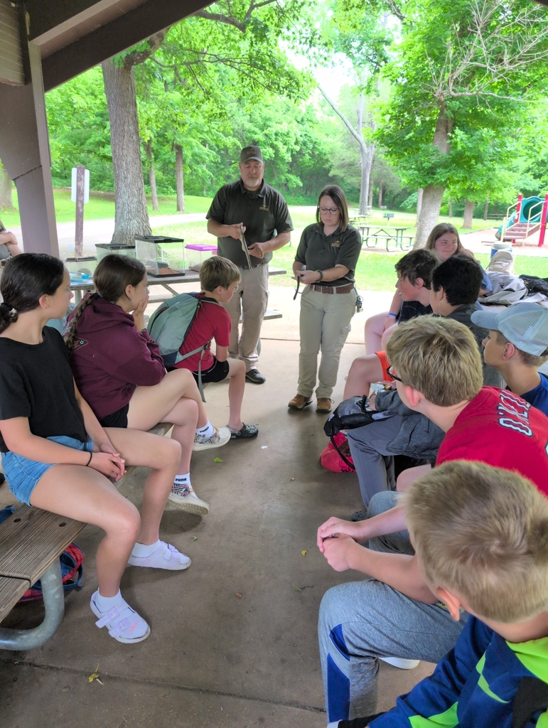 naturalists with snakes