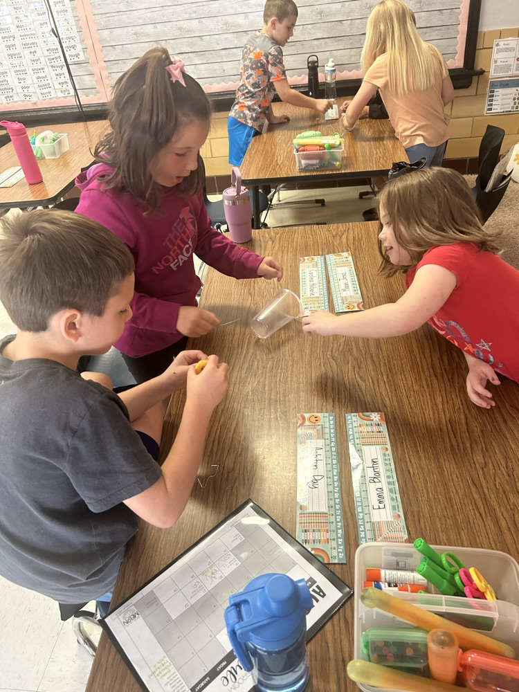 students working together to “save the worm"