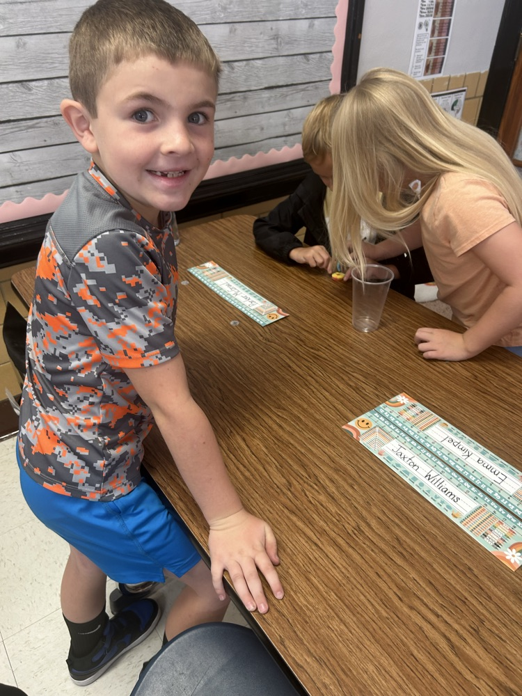 students working together to “save the worm”