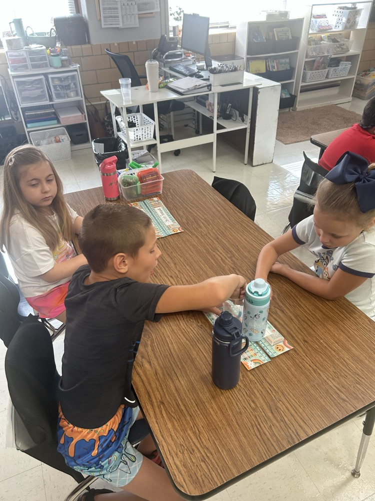 students working together to “save the worm”