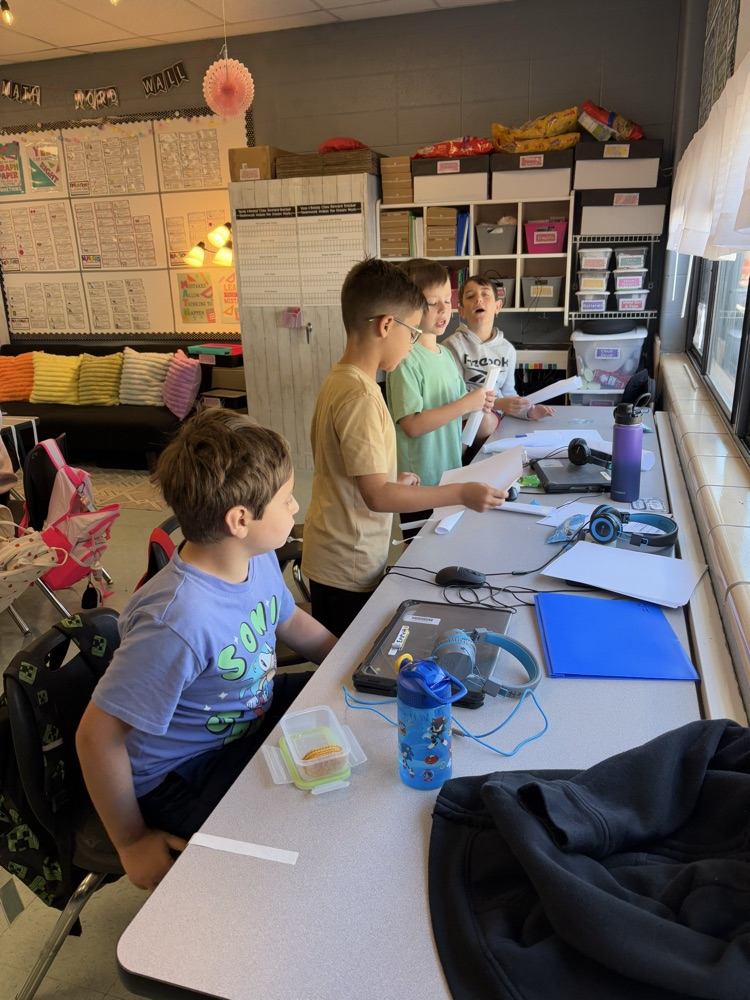 students building a structure to hold books